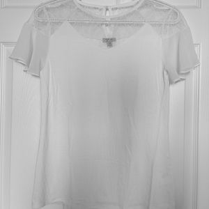 White t-shirt with lace top.